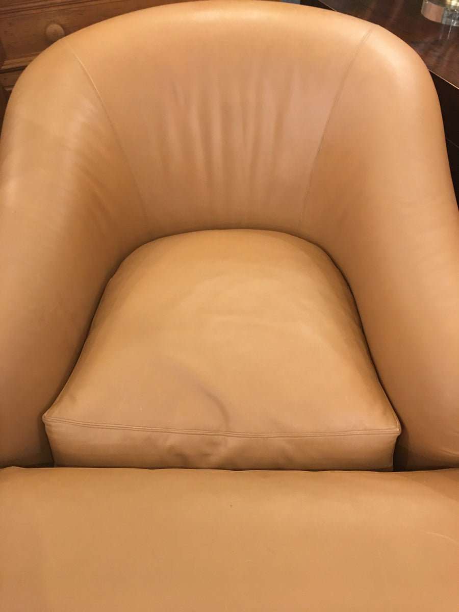BROWN LEATHER CHAIR AND OTTOMAN