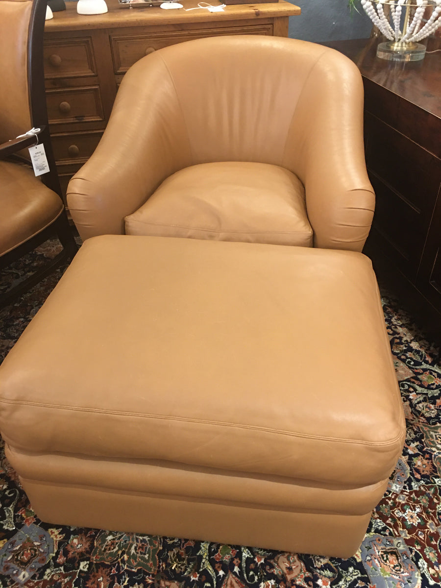 BROWN LEATHER CHAIR AND OTTOMAN